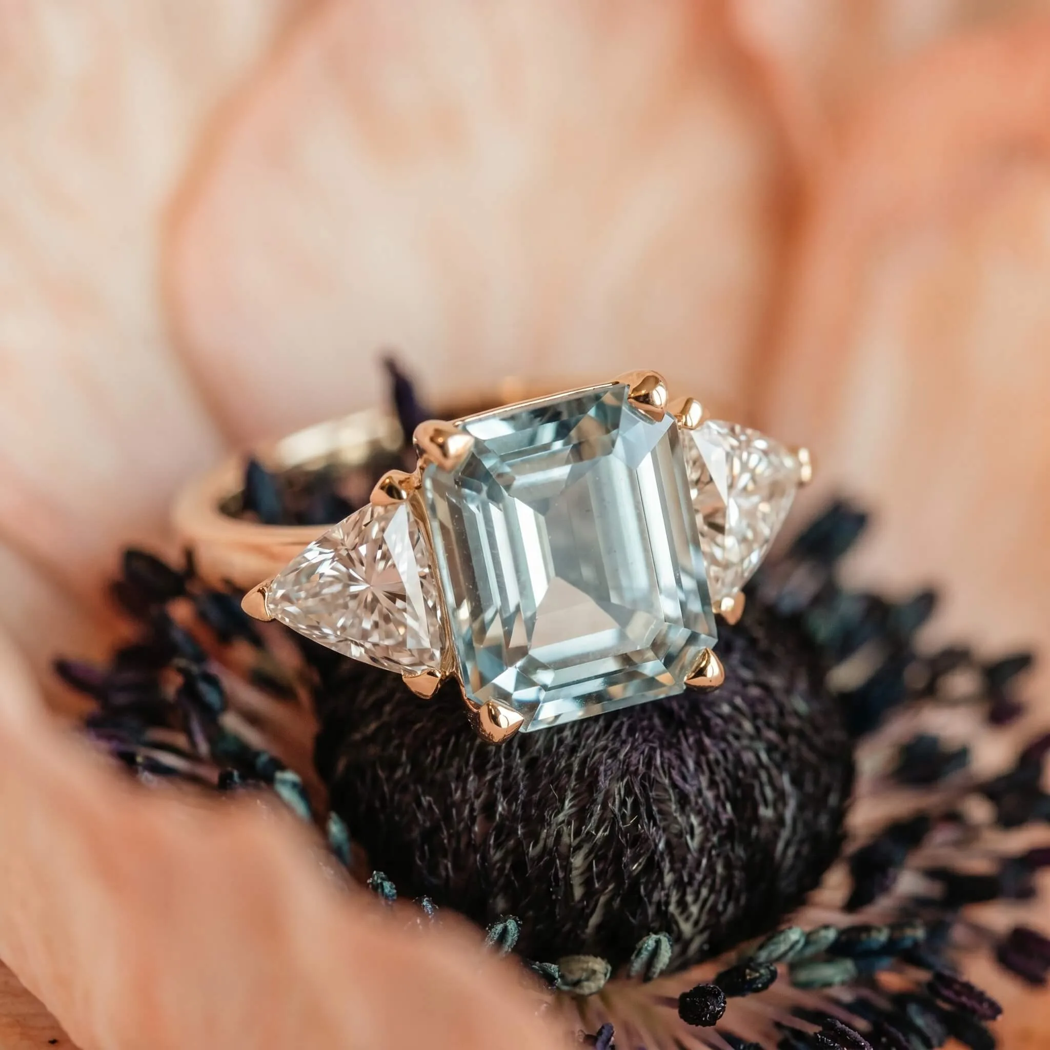 Aquamarine engagement ring with trillion cut diamonds