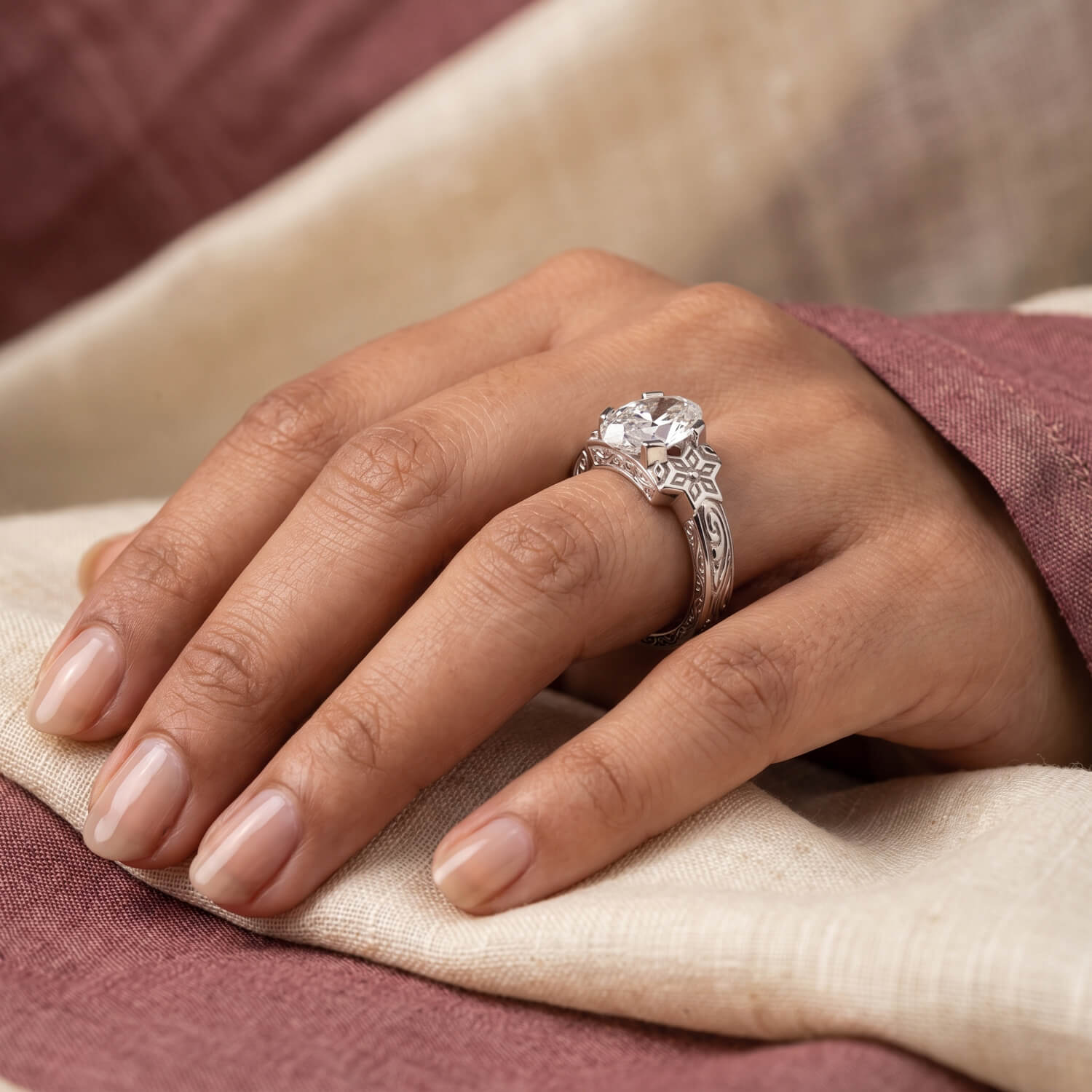 Kolam-inspired white-gold heritage engagement ring shown on hand