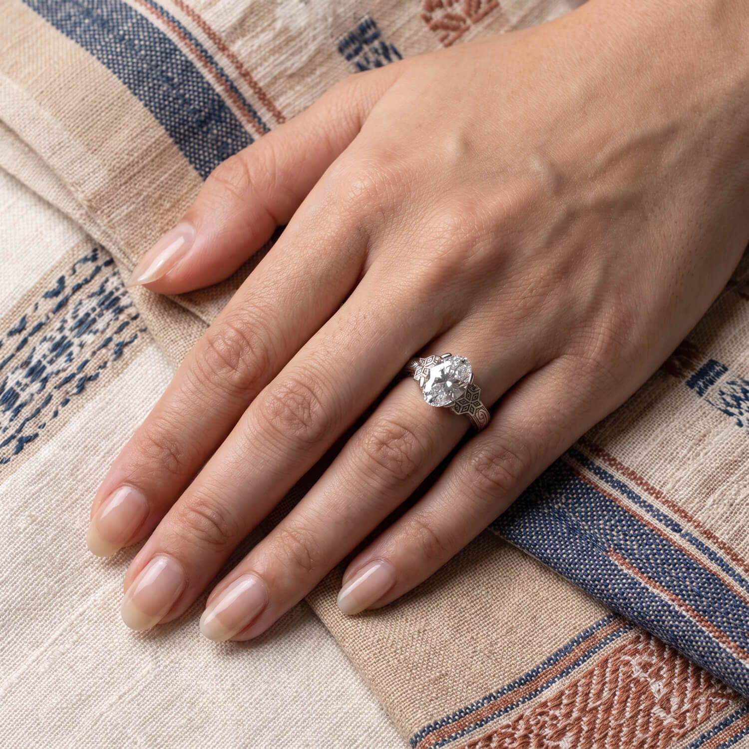 Oval center diamond remaining the focal point of the heritage ring