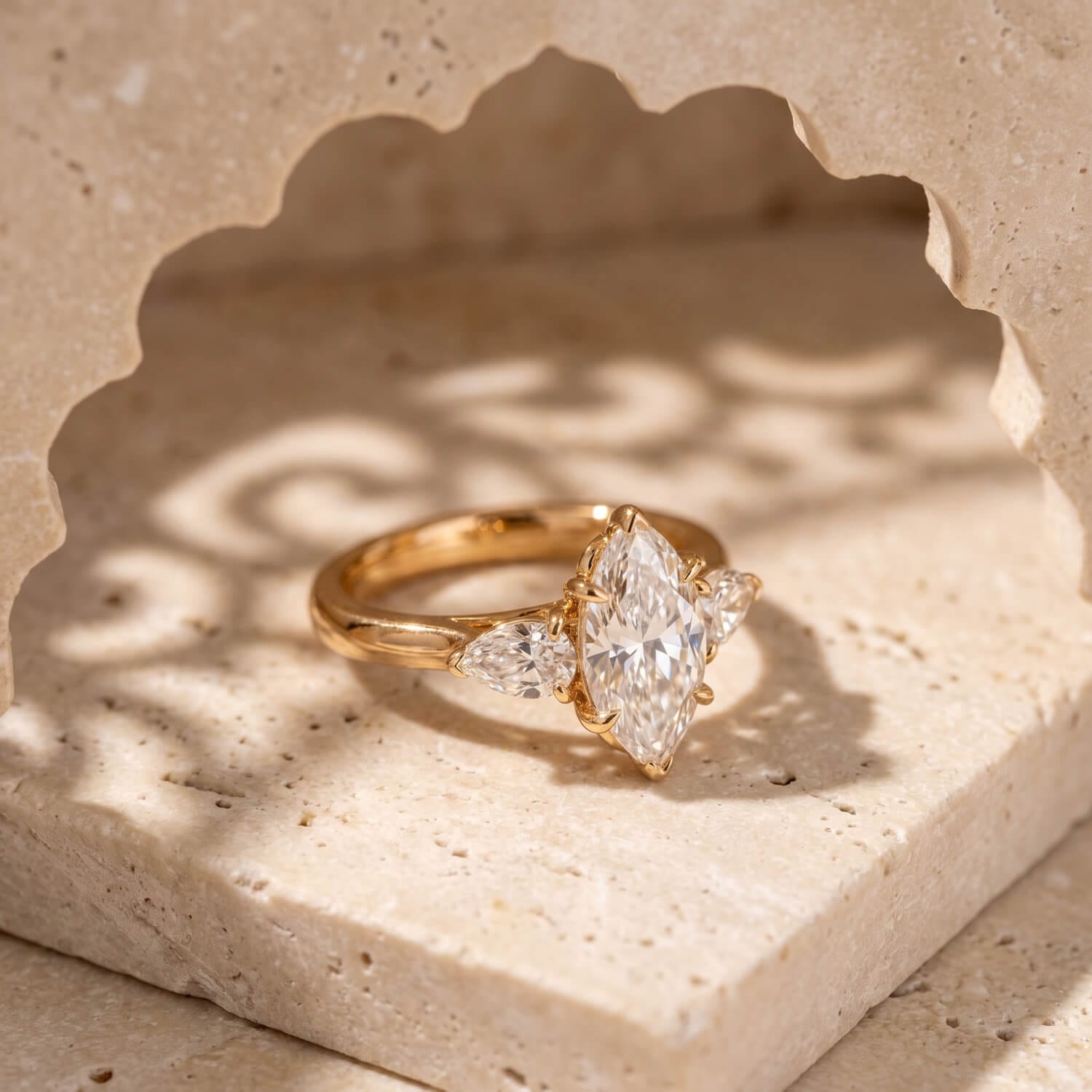 Custom elongated oval three-stone engagement ring