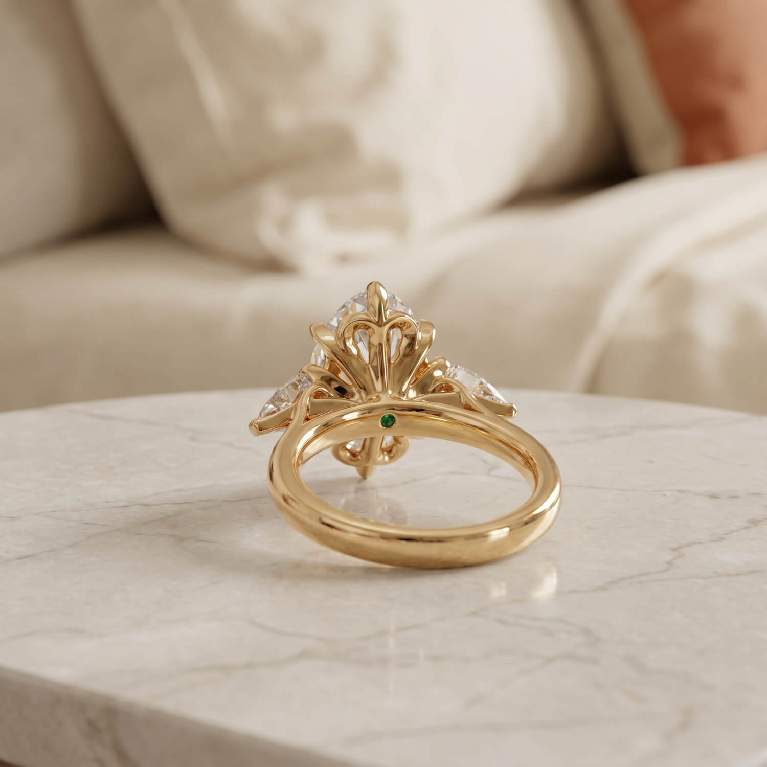 Pear-shaped side diamonds framing an elongated oval center diamond
