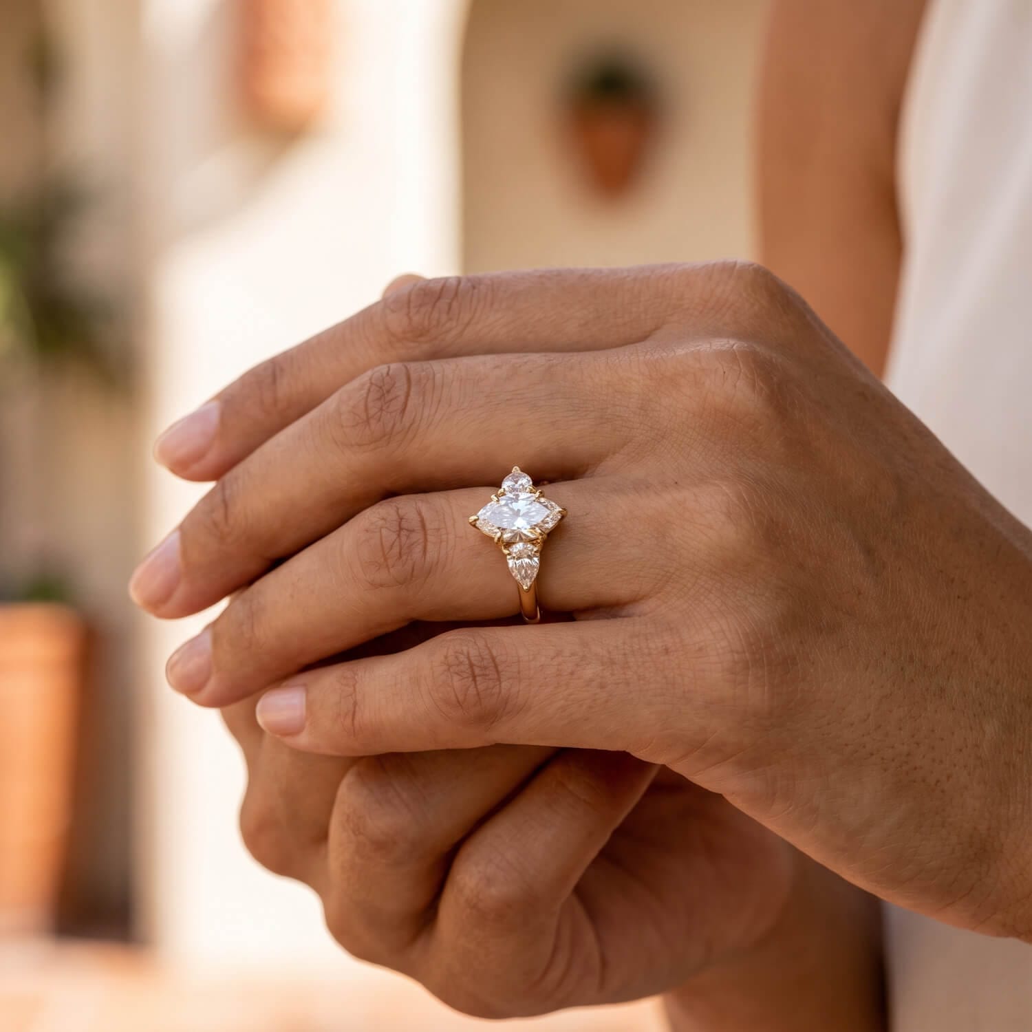 Elongated oval three-stone diamond ring in natural light