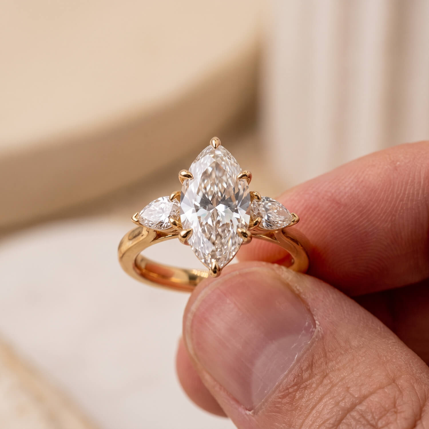 Elongated oval lab-grown diamond ring with pear diamond sides