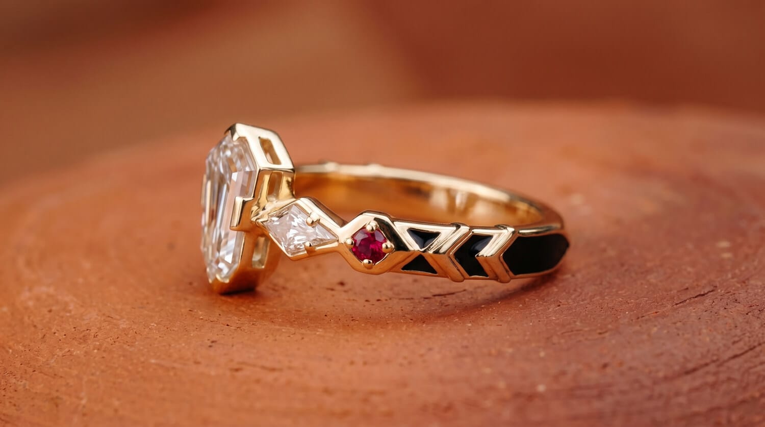Red rubies black enamel and 14K yellow gold representing Eswatini color references