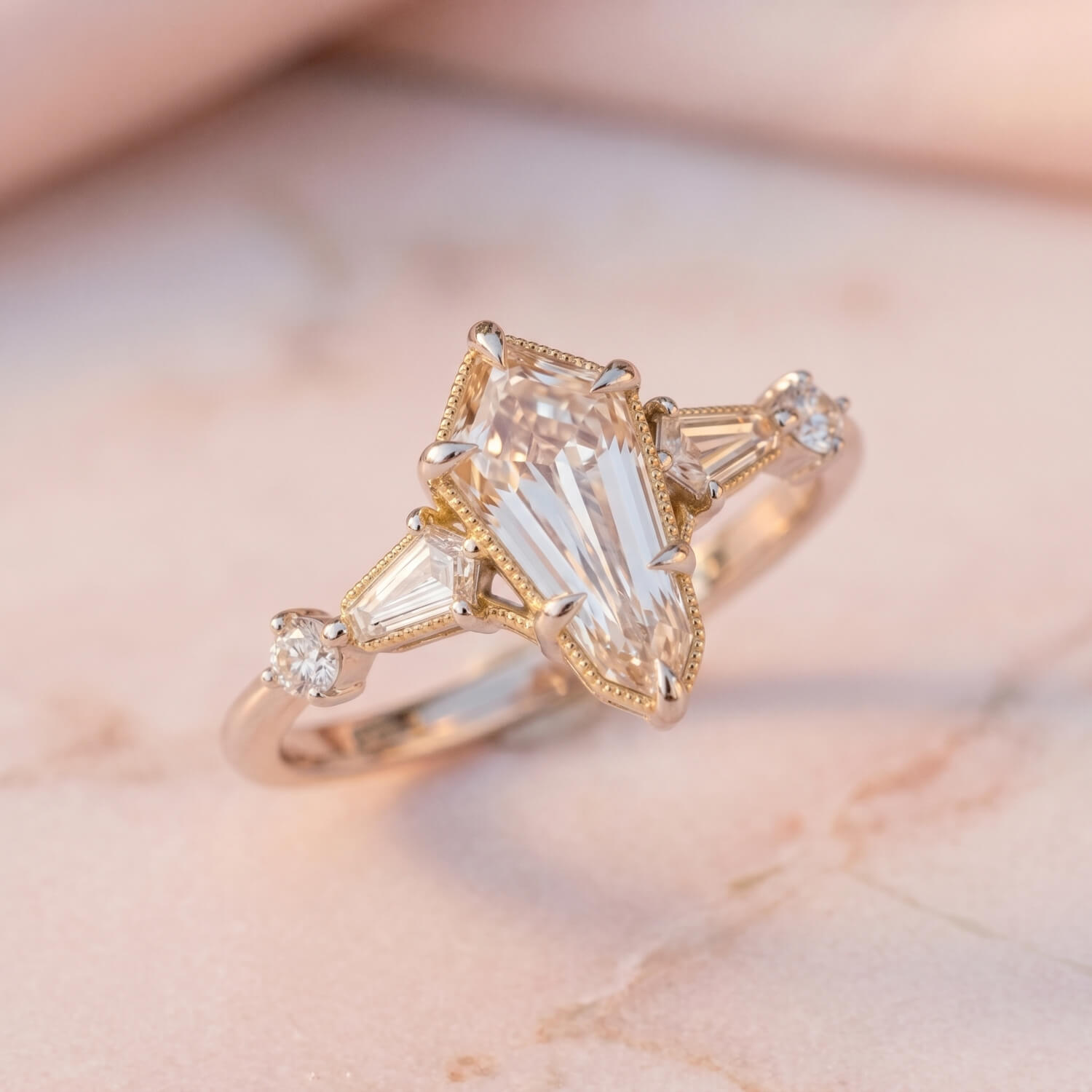 Kite-shaped diamond and accent stones shown from an alternate angle