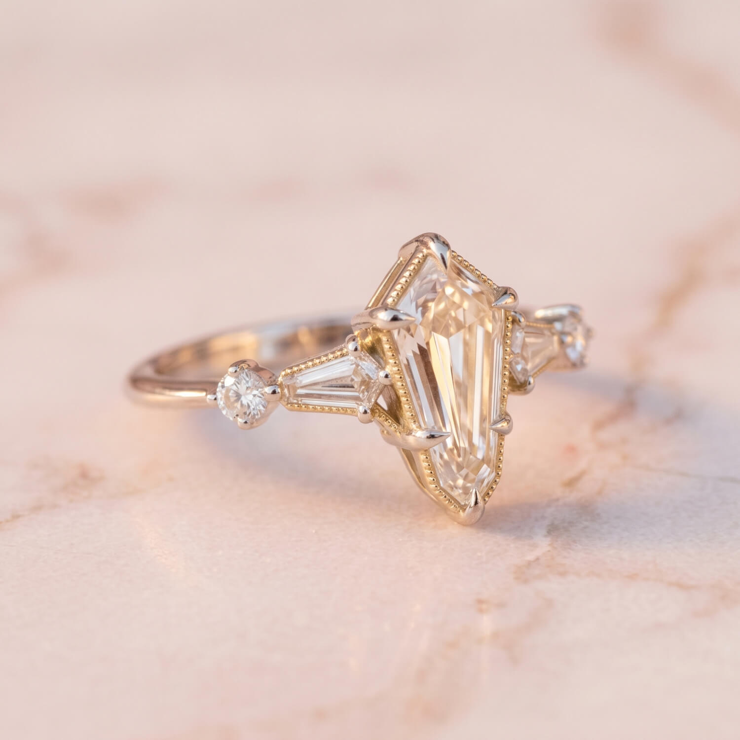 Bohemian kite-shaped diamond engagement ring in mixed yellow and white gold