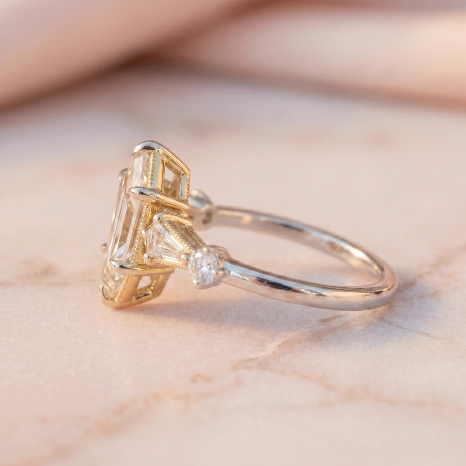 Two-tone engagement ring combining Art Deco geometry and bohemian details