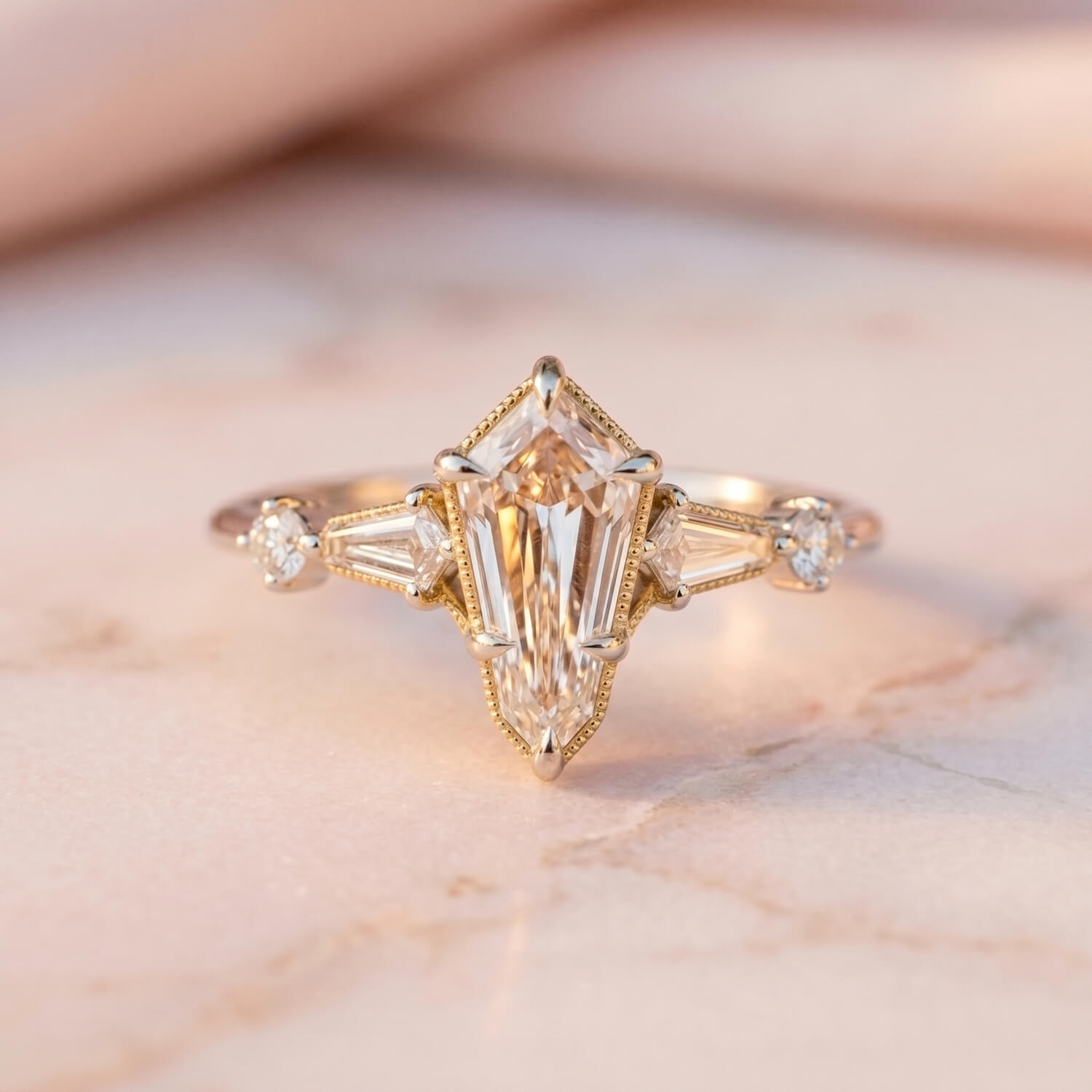 Custom kite-shaped diamond engagement ring with accent diamonds